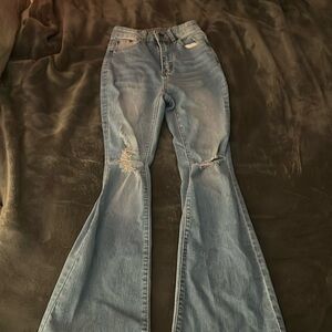 light wash blue jeans. flare